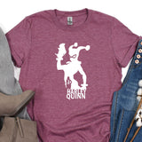 a women's t - shirt with a graphic of a man and a woman