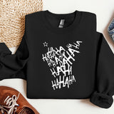 a black shirt with white writing on it next to a pair of shoes