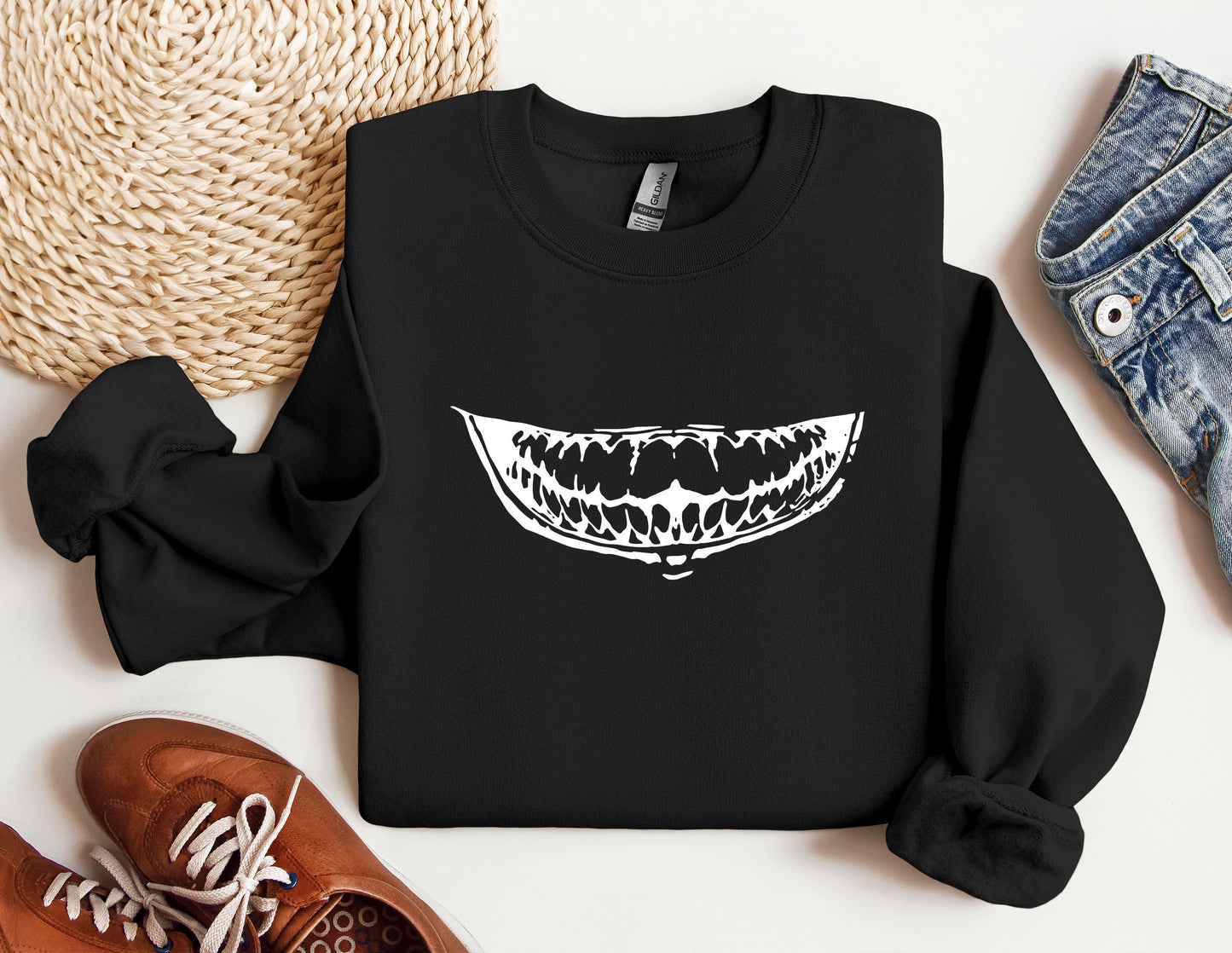 a black sweatshirt with an image of a mouth on it