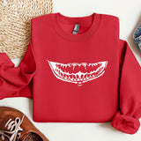 a red sweatshirt with a white teeth on it