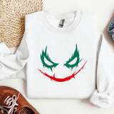 a sweater with a joker face painted on it