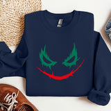 a blue sweatshirt with a red and green face on it