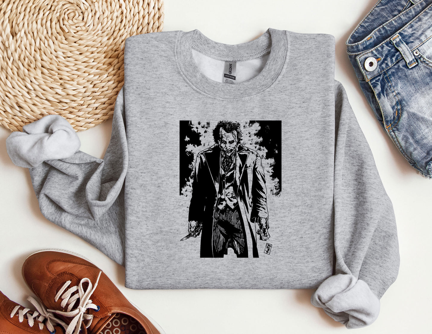 a sweater with a picture of a man holding a knife