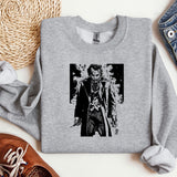a sweater with a picture of a man holding a knife