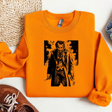 an orange shirt with a picture of a man holding a gun
