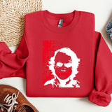 a red sweater with a picture of a man's face on it