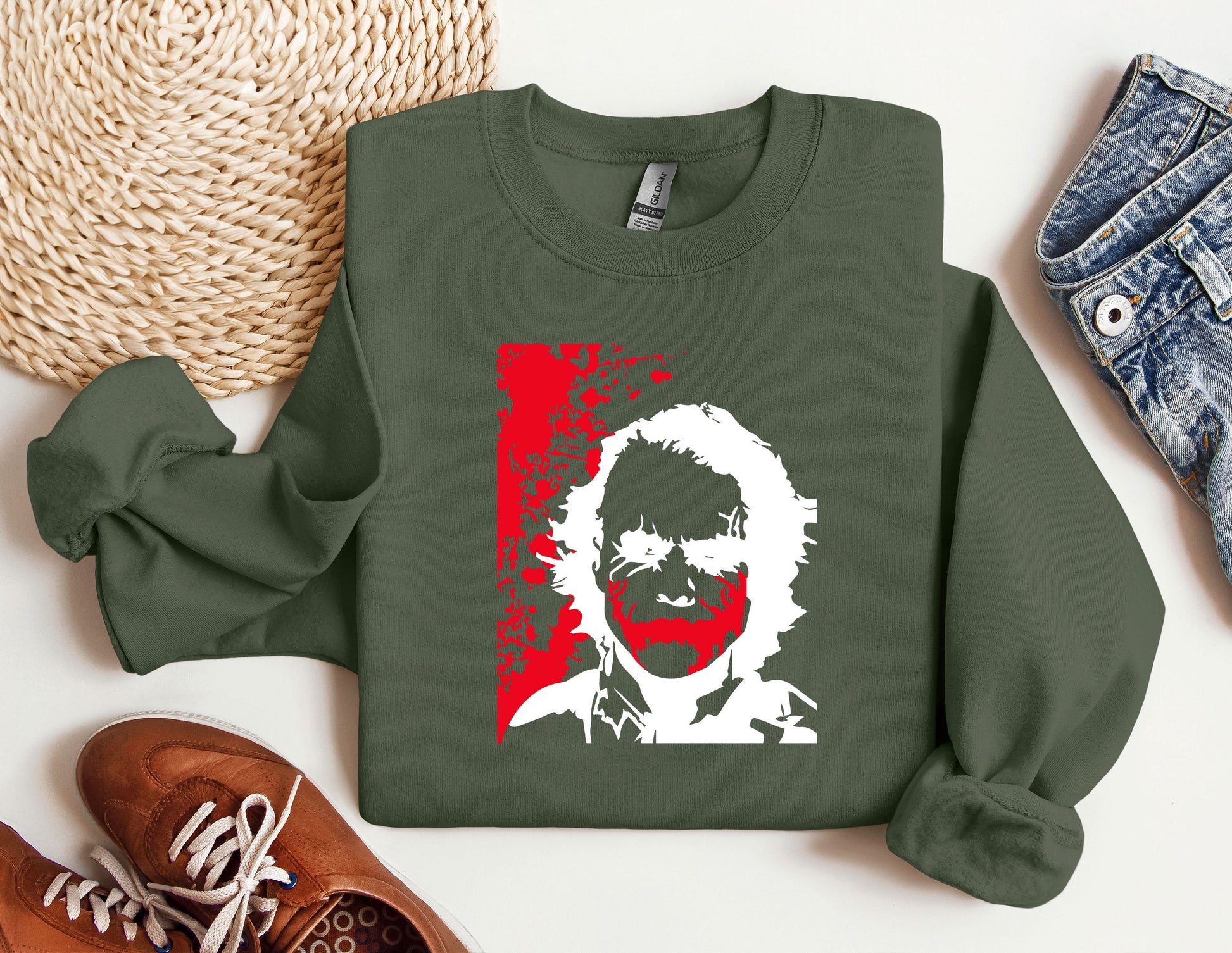 a green sweatshirt with a picture of a man&#39;s face on it