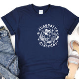 a t - shirt with a skeleton on it next to a pair of jeans