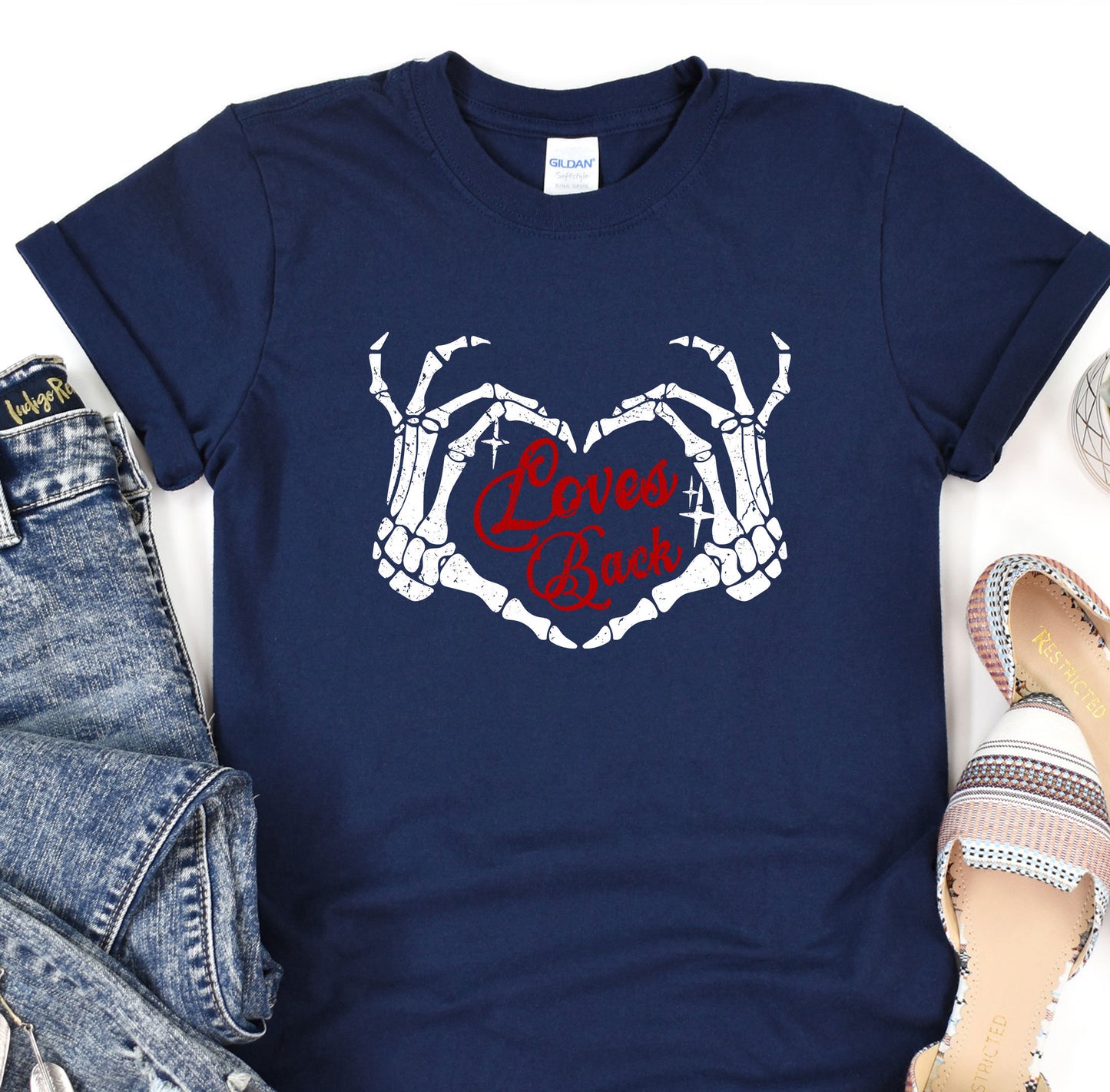 a t - shirt with a heart and bones on it