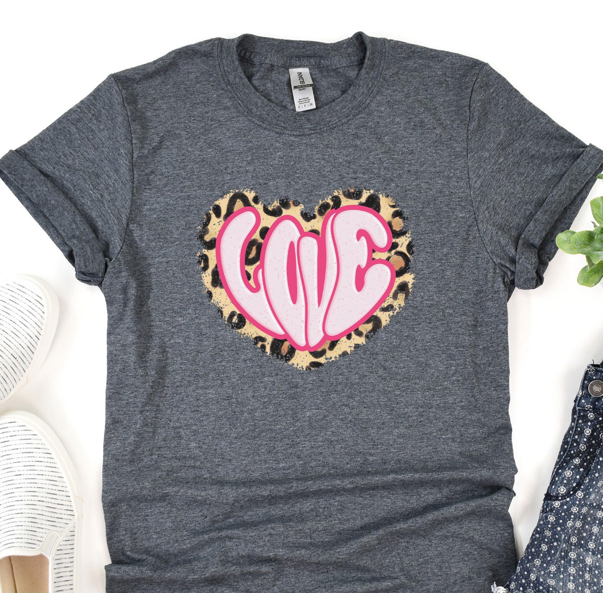 a t - shirt with a leopard print heart on it