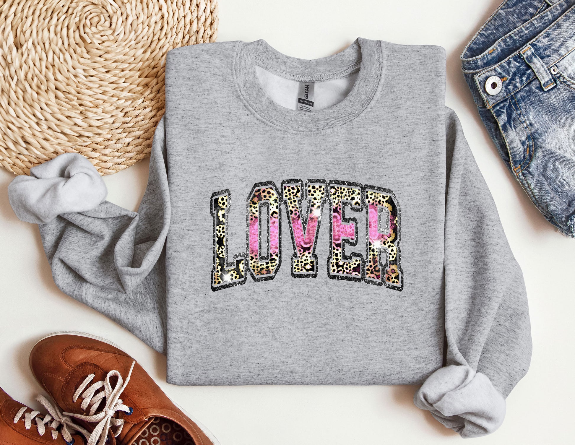 a sweatshirt with the word love written in leopard print