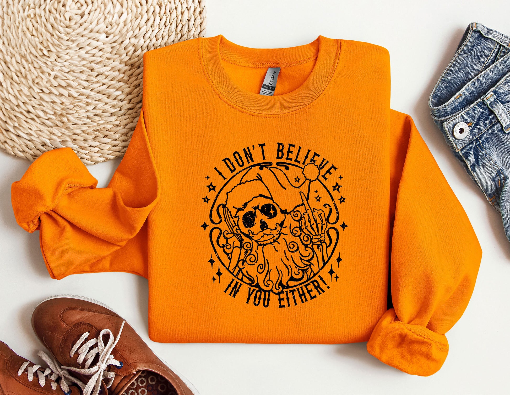 an orange shirt with a skull and a star on it