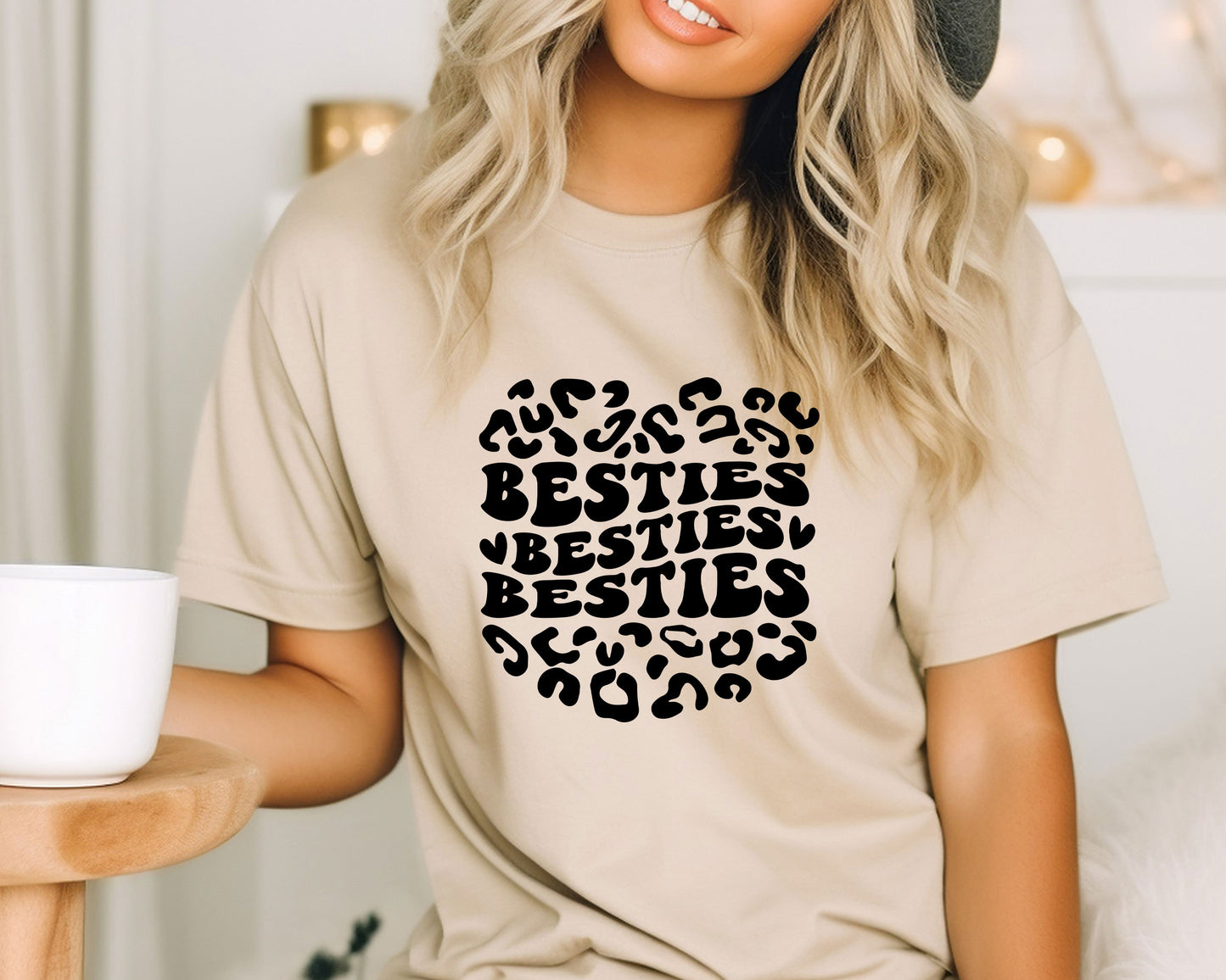 a woman wearing a t - shirt that says besties besties