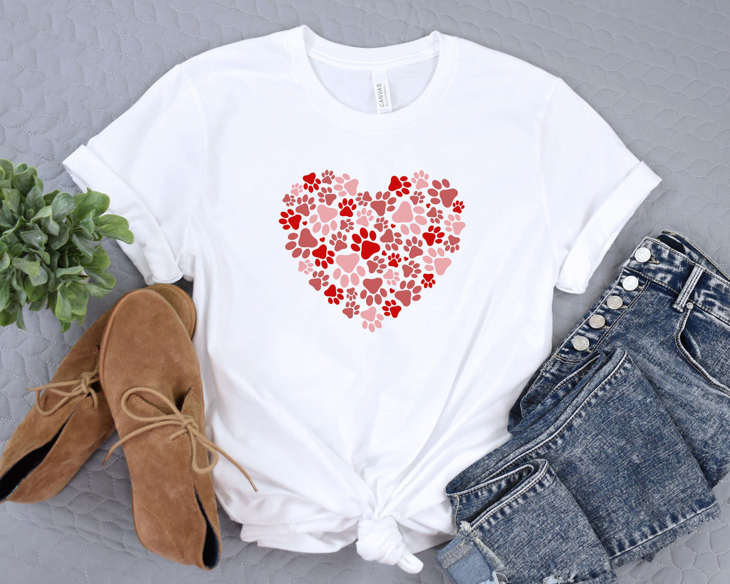 a t - shirt with a heart made out of paw prints