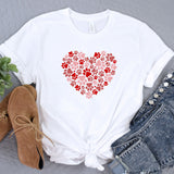 a t - shirt with a heart made out of paw prints