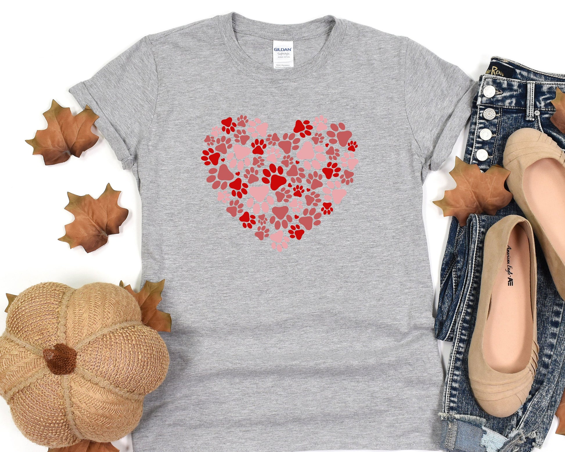 a t - shirt with a heart made out of paw prints