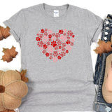 a t - shirt with a heart made out of paw prints