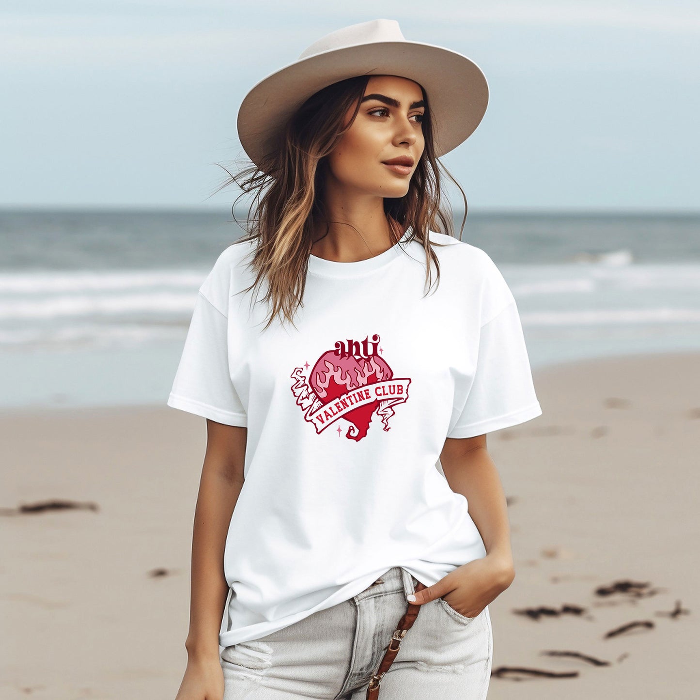 a woman wearing a white t - shirt with a heart on it