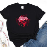 a black t - shirt with a pink heart on it