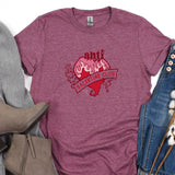 a t - shirt with a heart on it next to a pair of jeans