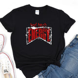 a black t - shirt with red lettering and a pair of jeans