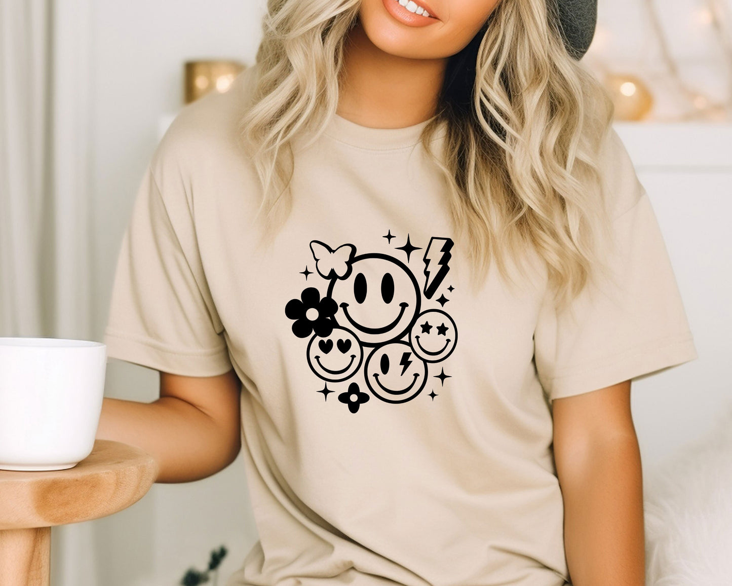 a woman wearing a t - shirt with a smiley face on it