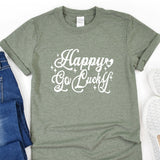 a t - shirt that says happy go lucky next to a pair of jeans
