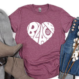 a t - shirt with the word bae on it next to a pair of jeans