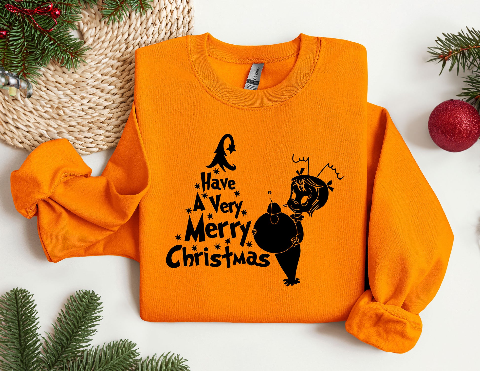 an orange sweatshirt with a christmas message on it