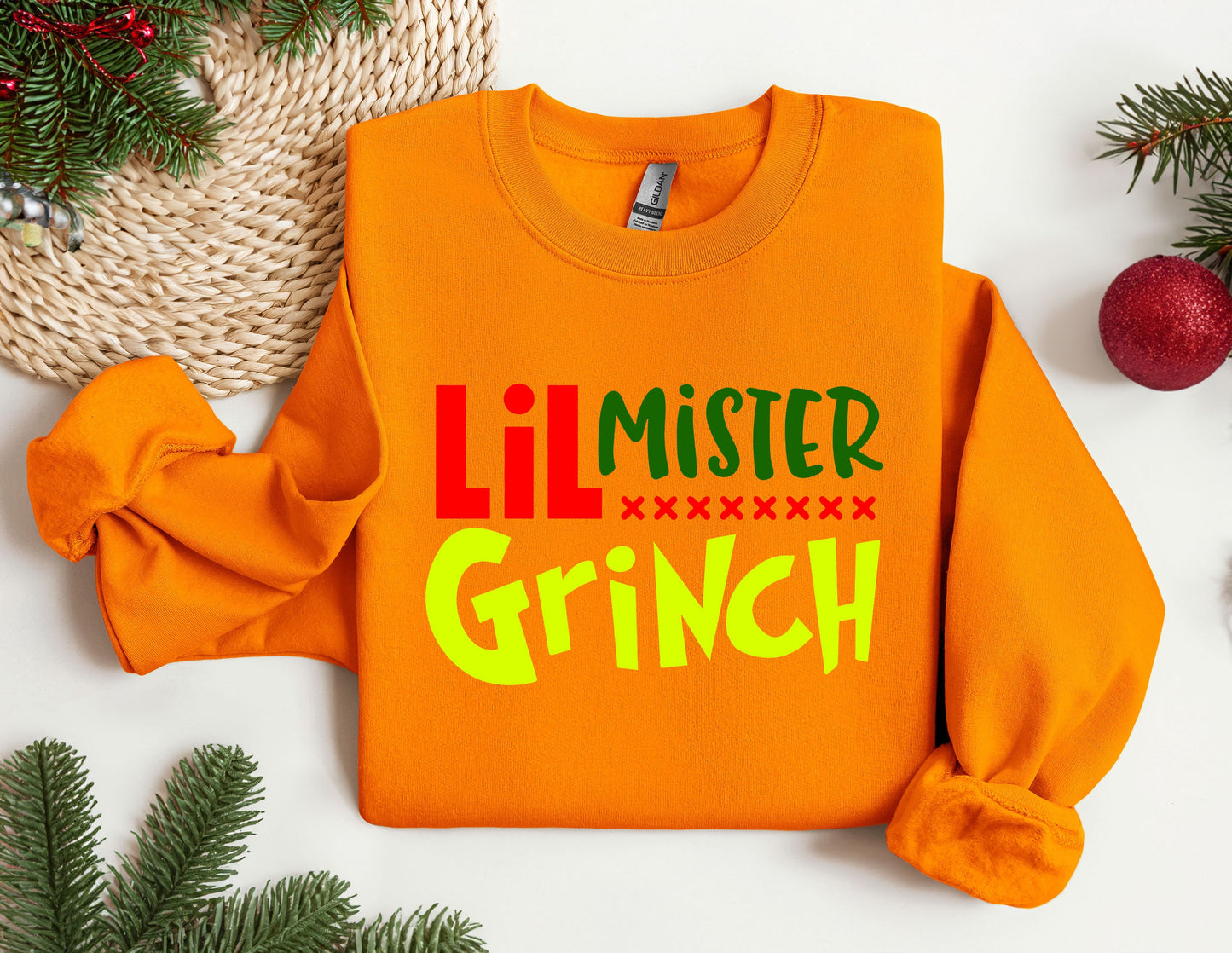 an orange sweater with the words&#39;ill mister grin&#39;on it