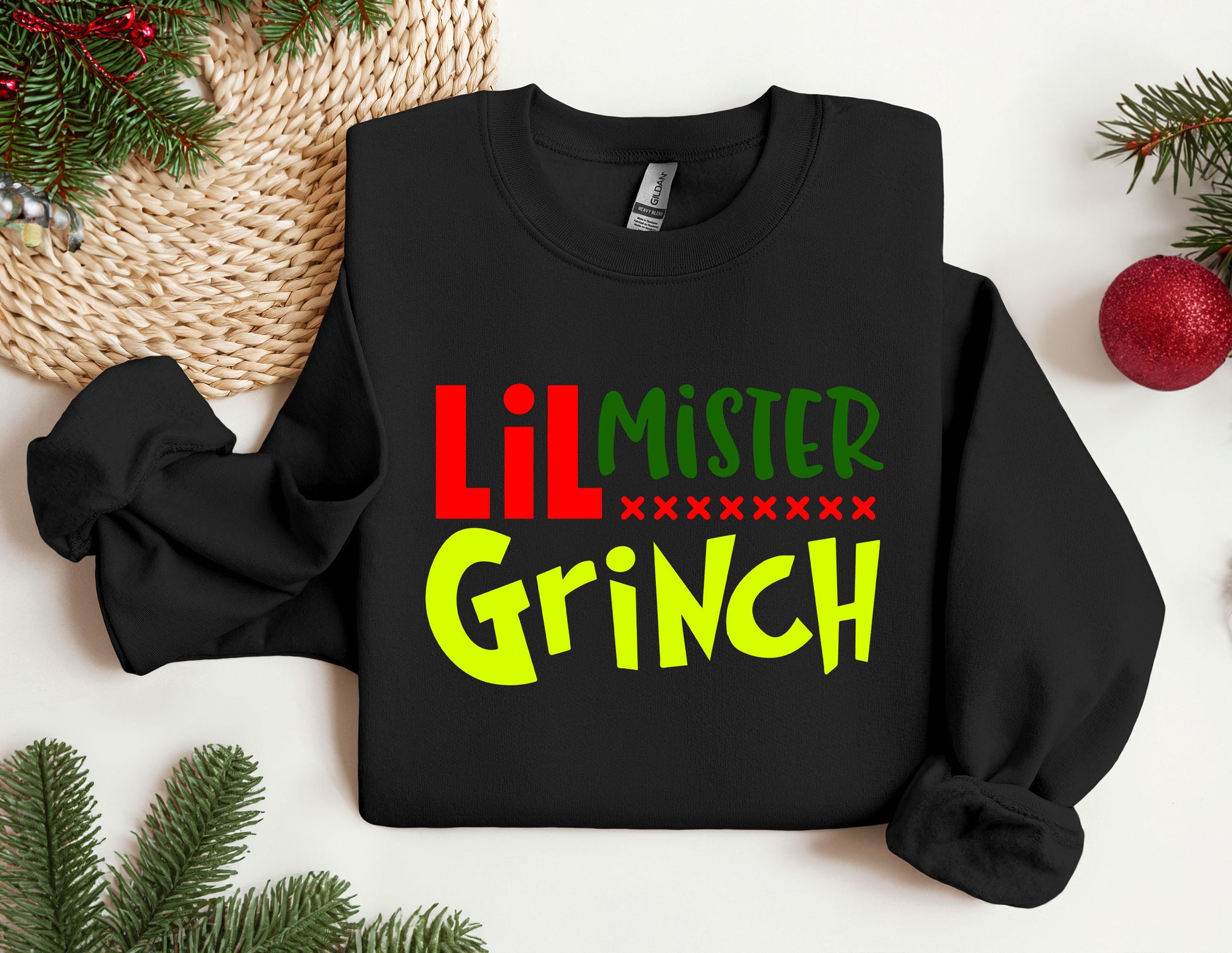 a black sweater with the words lil mister grin on it