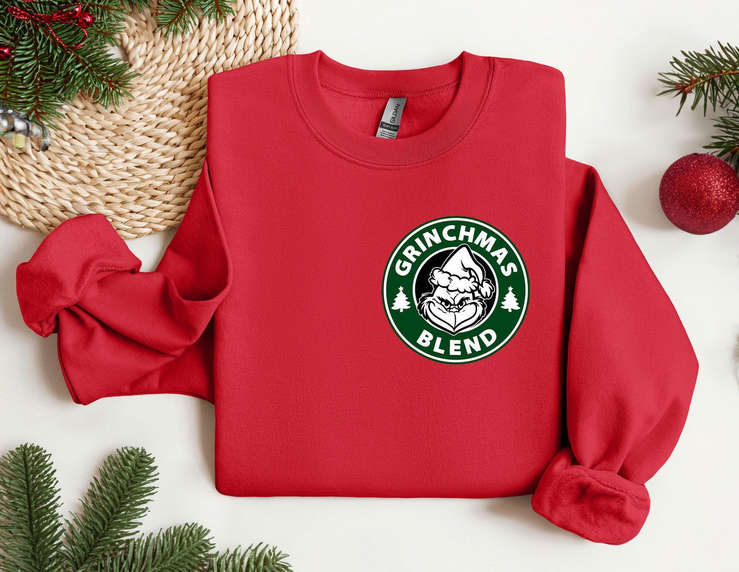 a red sweatshirt with a starbucks logo on it