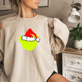 a woman wearing a sweatshirt with a santa hat on it