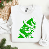 a white sweatshirt with a green image of a cat on it