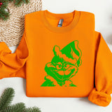 an orange sweatshirt with a green cat on it
