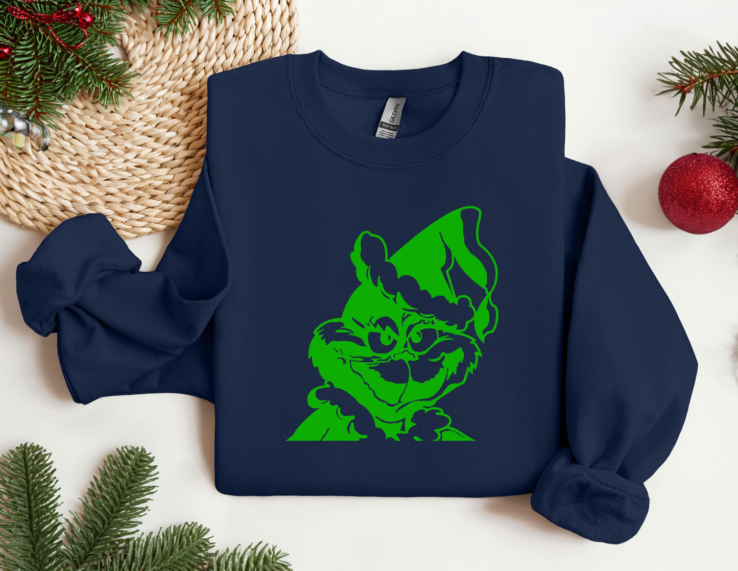 a blue sweatshirt with a green image of a dog on it