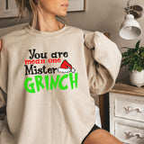 a woman wearing a sweatshirt that says you are mean one master grin