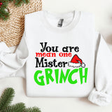 a white sweater with a green and red grin on it