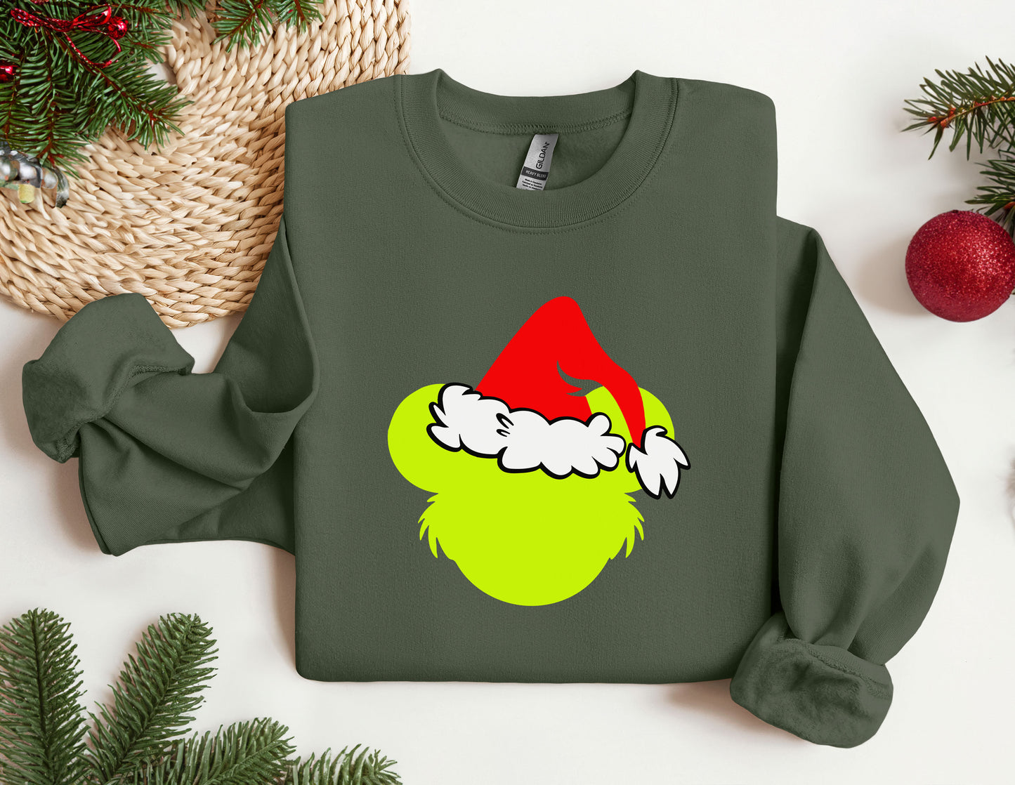 a green sweatshirt with a santa hat on it