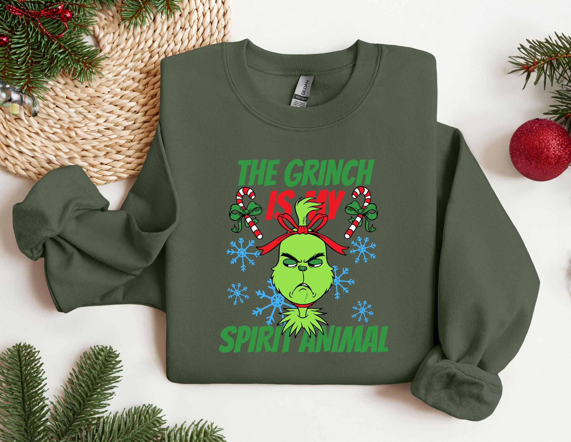 a green sweatshirt with the grinch is my spirit animal on it