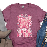 a t - shirt with a pink pig on it