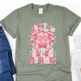 a t - shirt with a pink pig on it