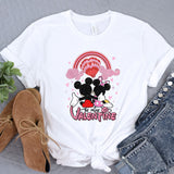 a white shirt with mickey and minnie mouse on it