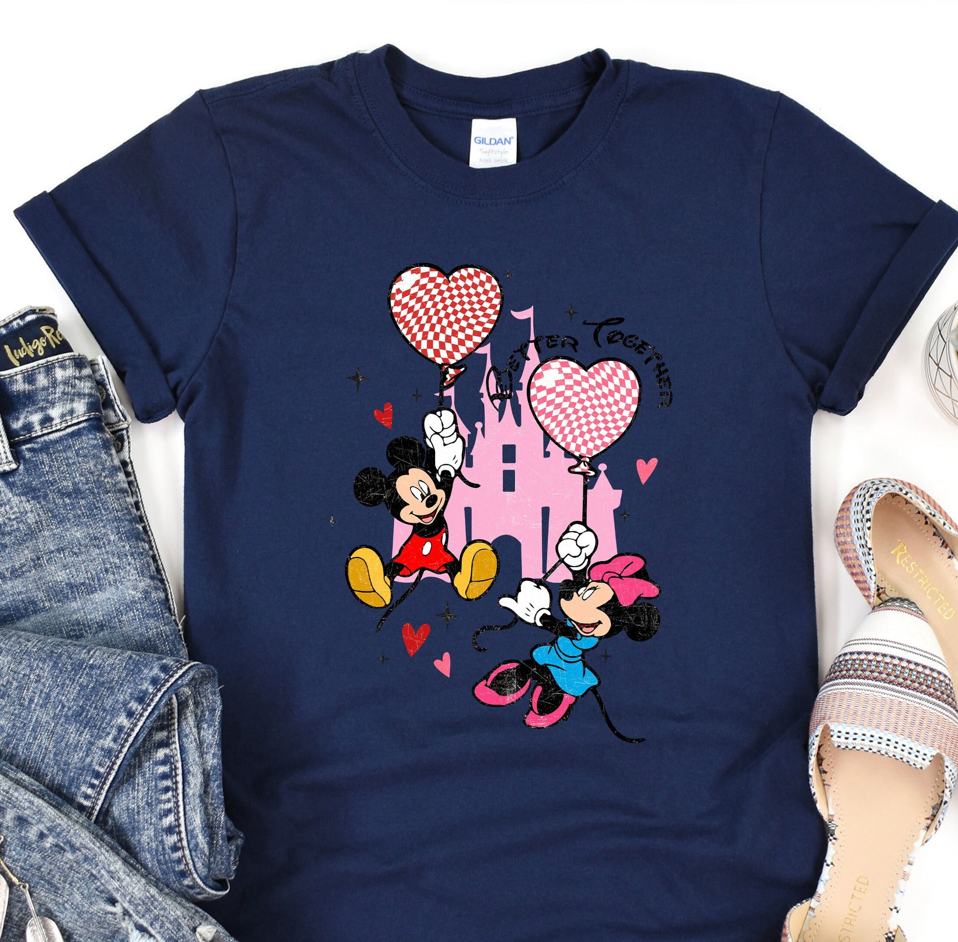 a t - shirt with a mickey mouse and minnie mouse on it