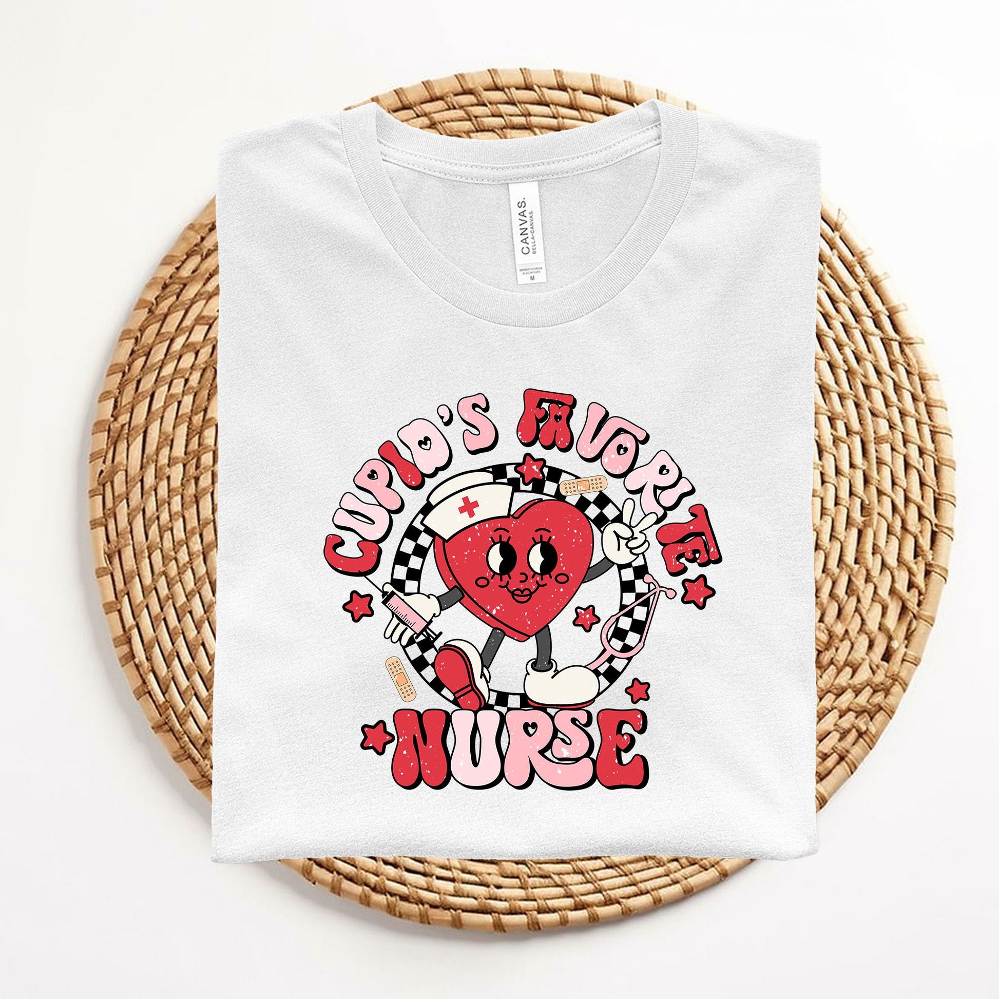 a white t - shirt with a red heart on it