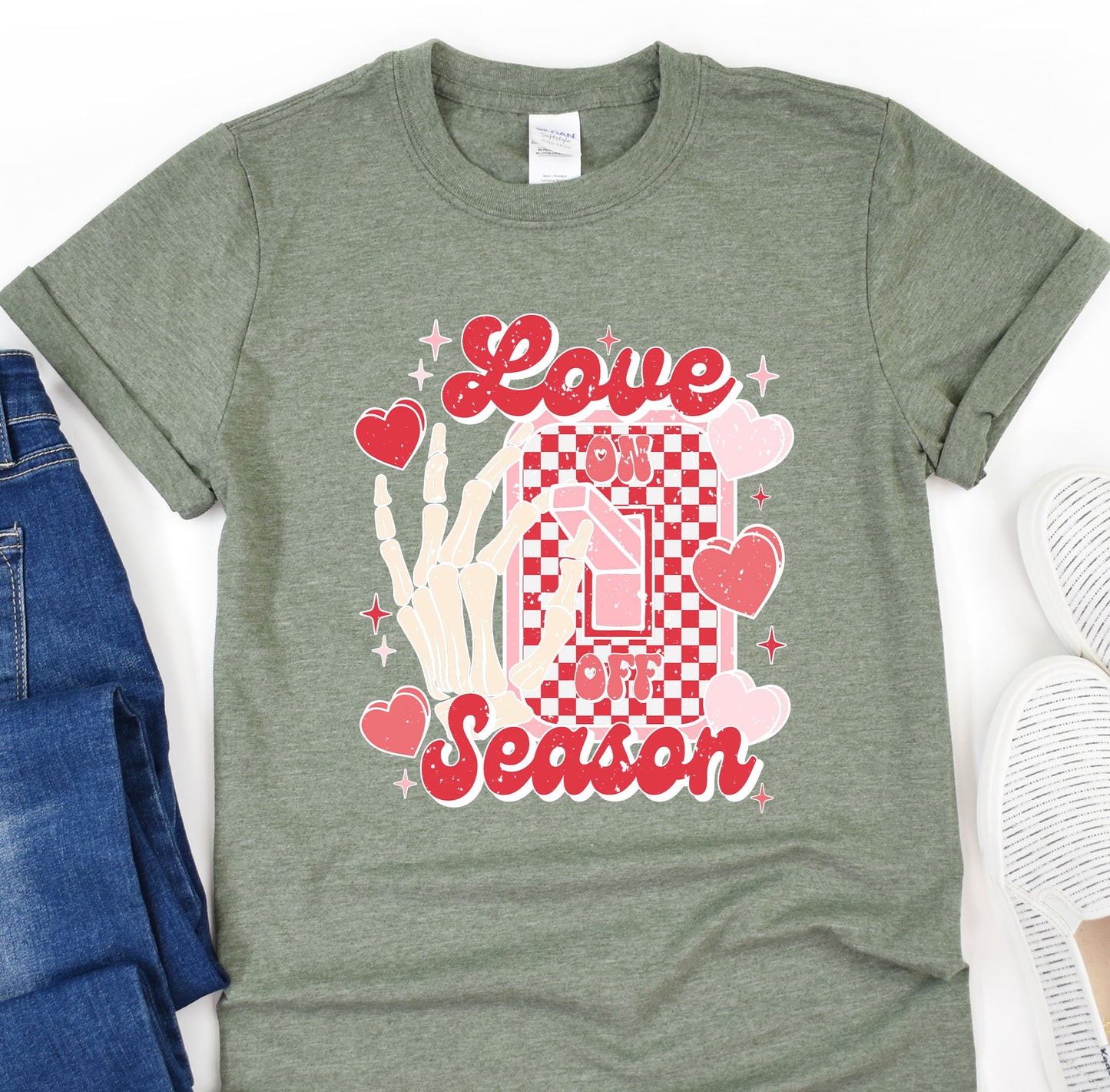 a t - shirt that says love season next to a pair of jeans