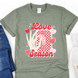 a t - shirt that says love season next to a pair of jeans