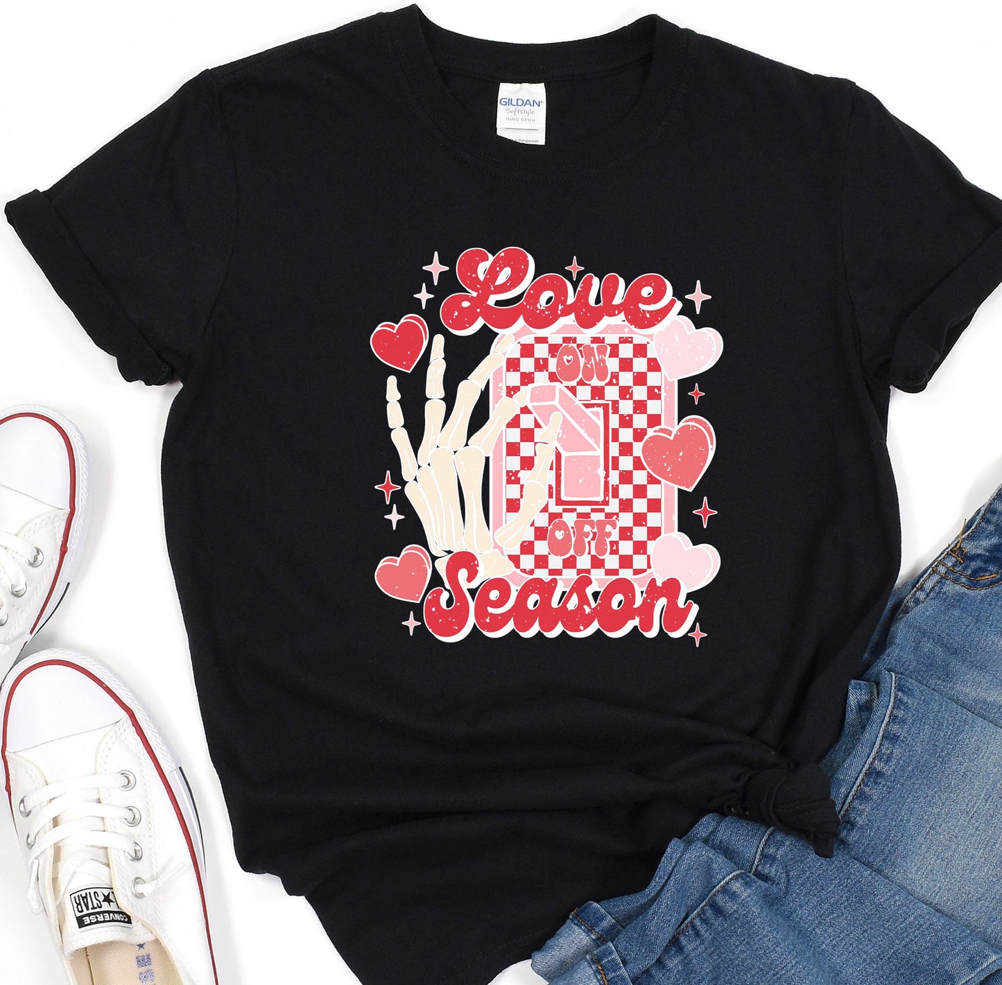 a black t - shirt with a checkerboard design