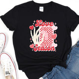 a black t - shirt with a checkerboard design