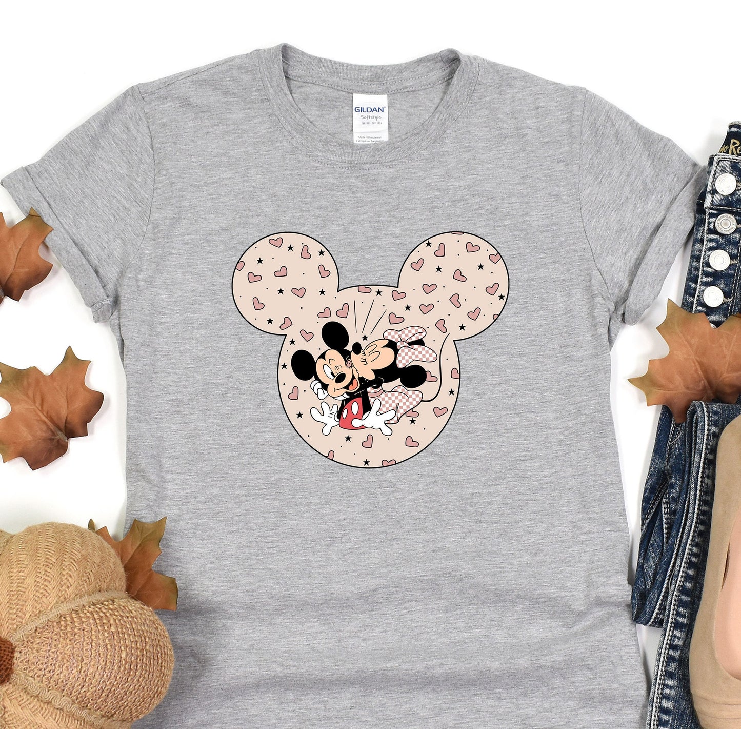 a gray shirt with a mickey mouse on it